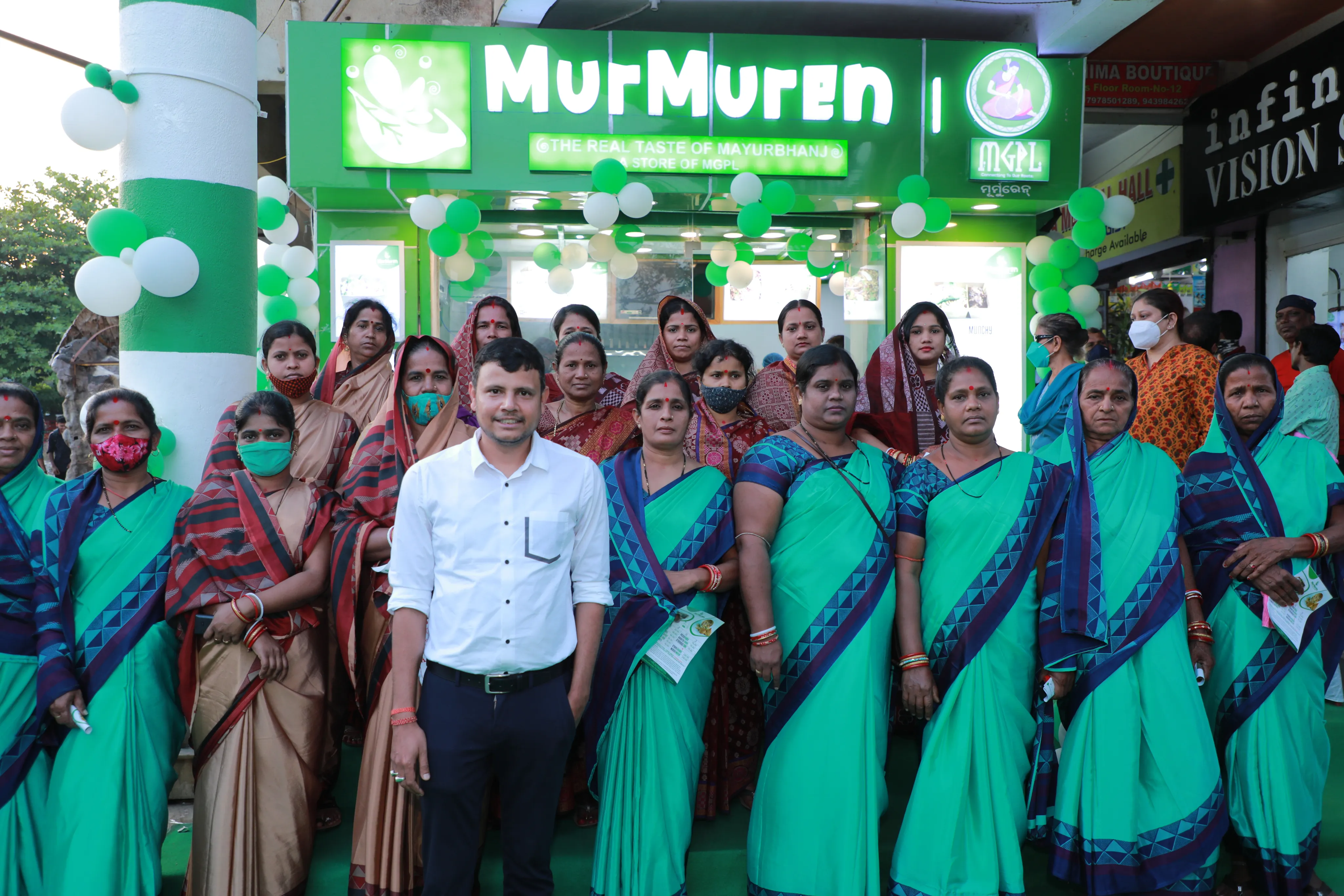 Staff team picture in front of the store
